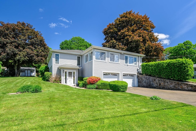 28 Sherry Ln, Danbury, CT 06811 - traditional home featuring concrete driveway, a front yard, and an attached garage