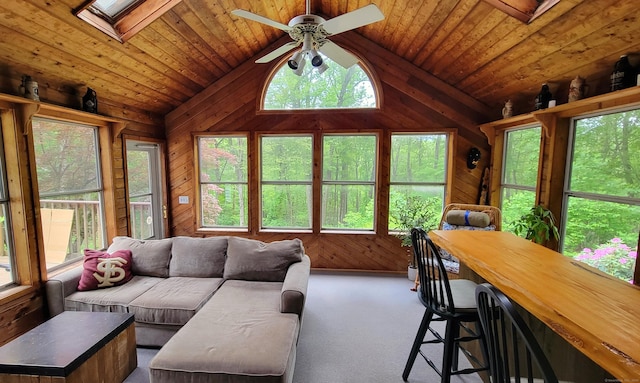 550 W Lake Ave, Guilford, CT 06437 - living room with lofted ceiling, wooden walls, ceiling fan, carpet flooring, and wooden ceiling