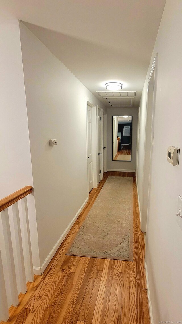 550 W Lake Ave, Guilford, CT 06437 - hallway featuring light wood-style flooring and baseboards