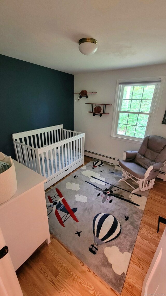 550 W Lake Ave, Guilford, CT 06437 - living area featuring baseboard heating and wood finished floors