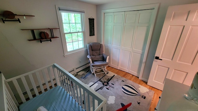 550 W Lake Ave, Guilford, CT 06437 - bedroom featuring light wood finished floors, a closet, and baseboard heating