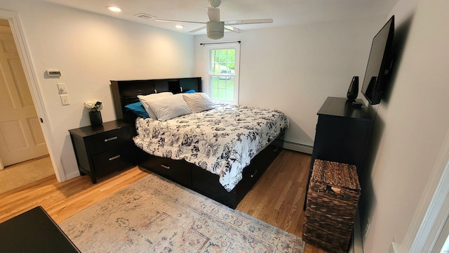 550 W Lake Ave, Guilford, CT 06437 - bedroom featuring light wood-style floors, baseboard heating, recessed lighting, and a ceiling fan
