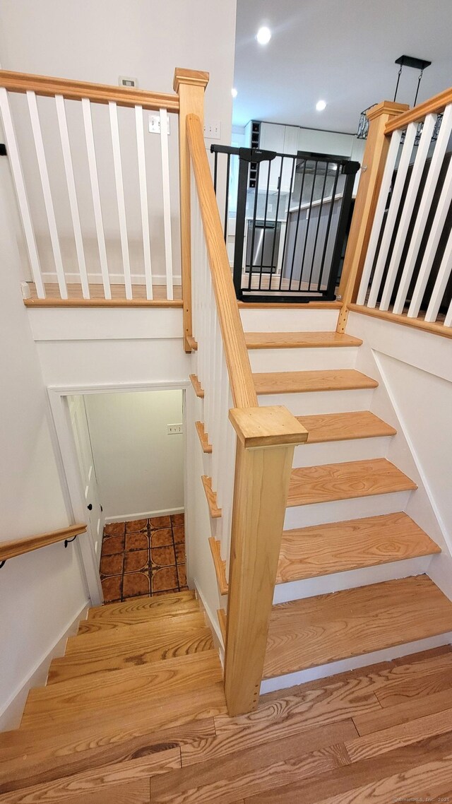 550 W Lake Ave, Guilford, CT 06437 - staircase with recessed lighting and wood finished floors