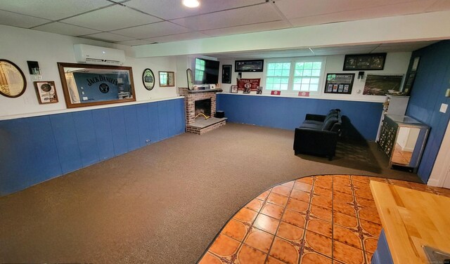 550 W Lake Ave, Guilford, CT 06437 - game room with a wall mounted AC, carpet, wainscoting, a fireplace, and a drop ceiling