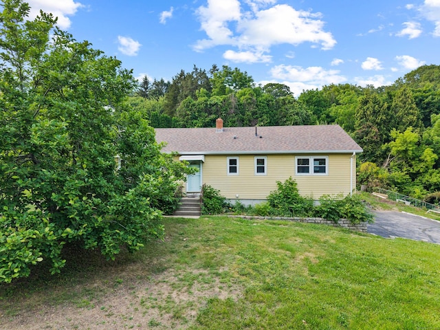 24 Ledgewood Ct, Norwich, CT 06360 - ranch-style house with a forest view, a chimney, and a shingled roof