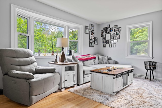 24 Ledgewood Ct, Norwich, CT 06360 - living area with healthy amount of natural light and light wood-style flooring