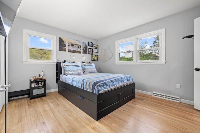 24 Ledgewood Ct, Norwich, CT 06360 - bedroom with light wood finished floors and multiple windows