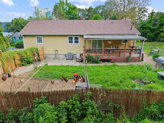 24 Ledgewood Ct, Norwich, CT 06360 - back of property featuring a deck, a fenced backyard, a patio area, and roof with shingles