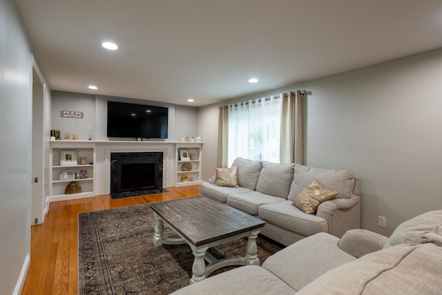 27 Judd Rd, Wethersfield, CT 06109 - living area with light wood finished floors, a premium fireplace, and recessed lighting