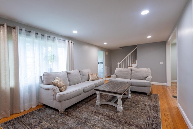 27 Judd Rd, Wethersfield, CT 06109 - living area with recessed lighting, light wood finished floors, stairway, and baseboards