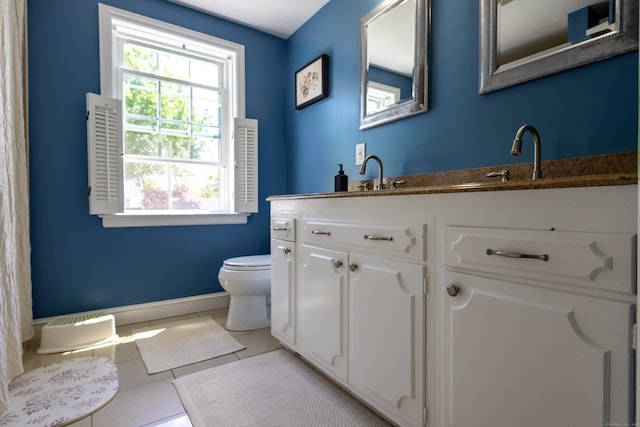 27 Judd Rd, Wethersfield, CT 06109 - full bathroom with toilet, vanity, tile patterned floors, and baseboards
