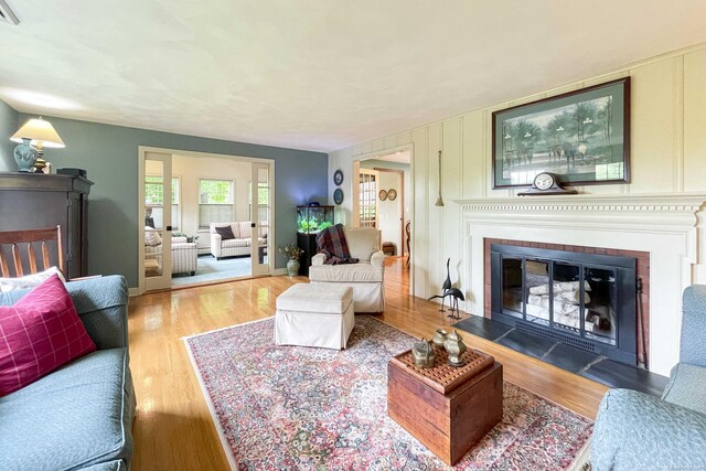 72 Cox Rd, Portland, CT 06480 - living room featuring a glass covered fireplace and wood finished floors