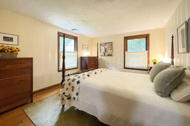 72 Cox Rd, Portland, CT 06480 - bedroom with wood finished floors, multiple windows, and baseboards
