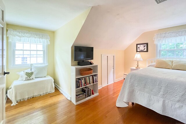 72 Cox Rd, Portland, CT 06480 - bedroom featuring wood finished floors, lofted ceiling, baseboards, and a baseboard radiator
