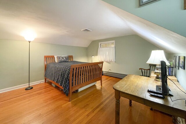 72 Cox Rd, Portland, CT 06480 - bedroom with wood finished floors, a baseboard radiator, vaulted ceiling, and baseboards