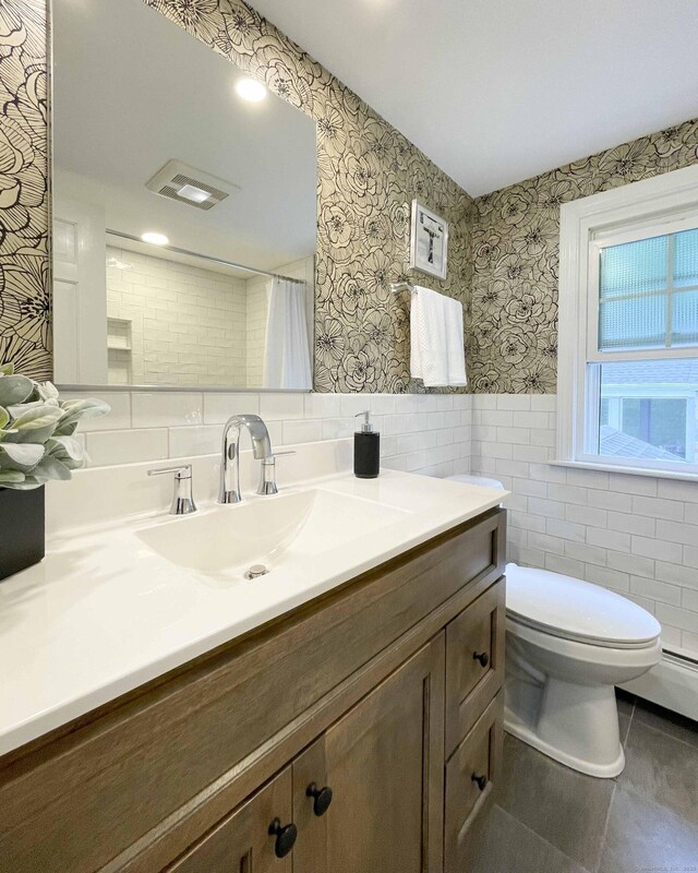 72 Cox Rd, Portland, CT 06480 - bathroom with tile walls, vanity, tile patterned floors, wallpapered walls, and toilet