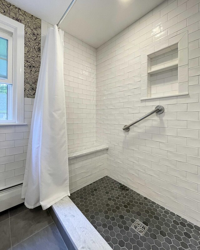 72 Cox Rd, Portland, CT 06480 - full bath with a tile shower, tile patterned floors, a baseboard radiator, and tile walls