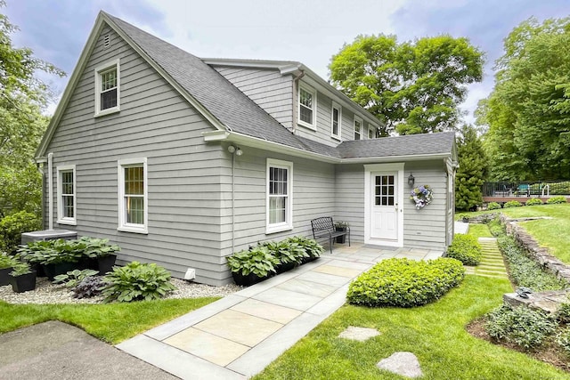 72 Cox Rd, Portland, CT 06480 - view of front facade featuring roof with shingles, a deck, and a front yard