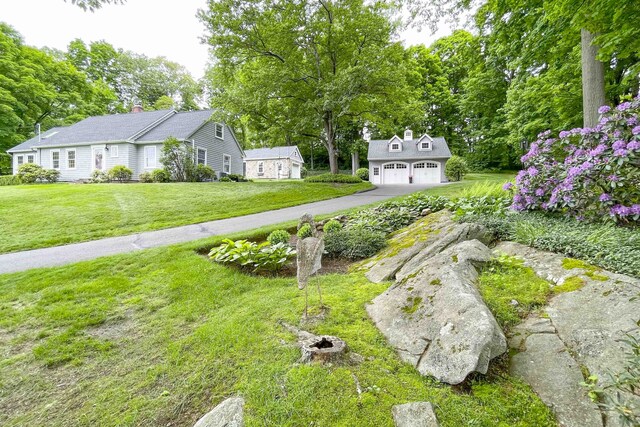 72 Cox Rd, Portland, CT 06480 - view of grassy yard featuring an outbuilding, a garage, and asphalt driveway