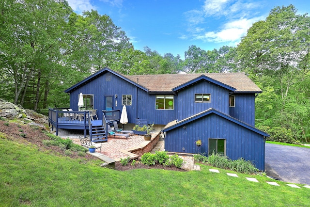 26 Freedman Ln, Monroe, CT 06468 - rear view of house with a deck, a yard, and roof with shingles