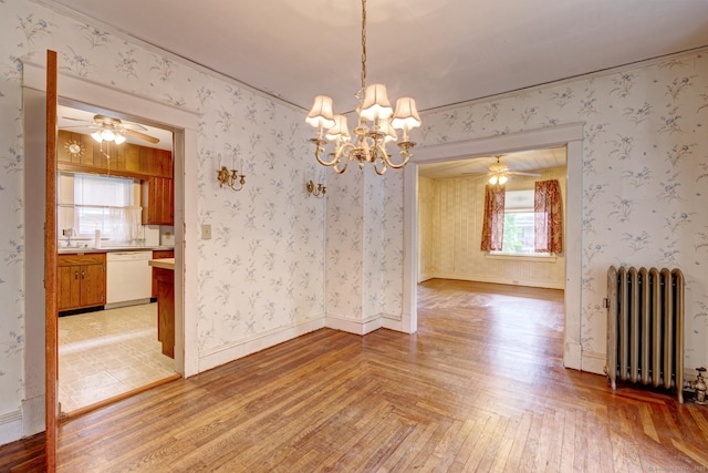 45 Perkins Ave, Norwich, CT 06360 - unfurnished dining area with radiator, ceiling fan, a chandelier, and a sink