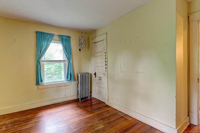45 Perkins Ave, Norwich, CT 06360 - unfurnished room featuring radiator heating unit, wood-type flooring, and baseboards