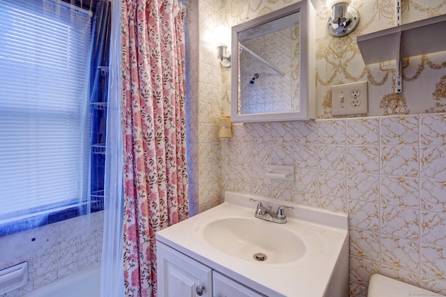 45 Perkins Ave, Norwich, CT 06360 - full bath with tile walls, vanity, shower / bath combo with shower curtain, and toilet