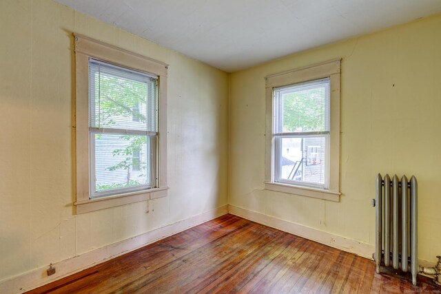 45 Perkins Ave, Norwich, CT 06360 - unfurnished room featuring radiator and hardwood / wood-style floors