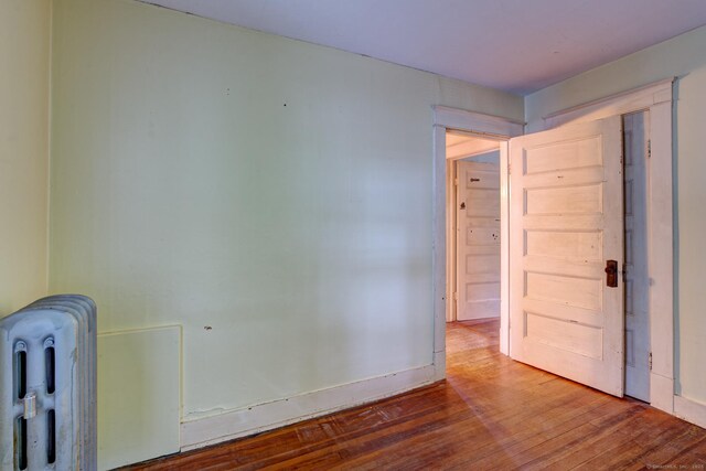 45 Perkins Ave, Norwich, CT 06360 - unfurnished room featuring radiator and wood finished floors