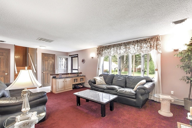 47 Delmont Rd, East Hartford, CT 06108 - living room featuring a textured ceiling, dark carpet, baseboard heating, and a baseboard radiator