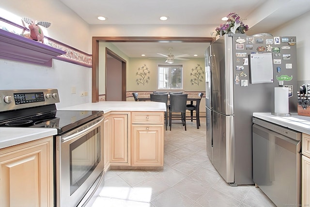 47 Delmont Rd, East Hartford, CT 06108 - kitchen featuring stainless steel appliances, light countertops, a ceiling fan, light tile patterned floors, and recessed lighting