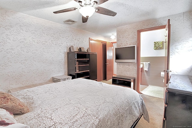 47 Delmont Rd, East Hartford, CT 06108 - carpeted bedroom with wallpapered walls, a textured ceiling, ceiling fan, ensuite bathroom, and a closet