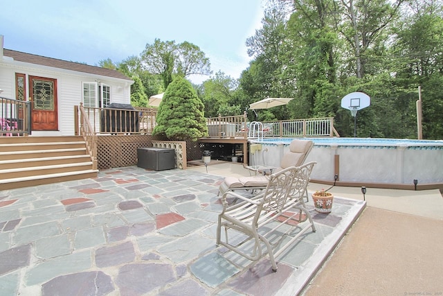 47 Delmont Rd, East Hartford, CT 06108 - view of patio / terrace featuring a wooden deck, an outdoor pool, and stairs