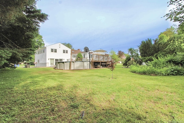 47 Delmont Rd, East Hartford, CT 06108 - view of green lawn with a deck