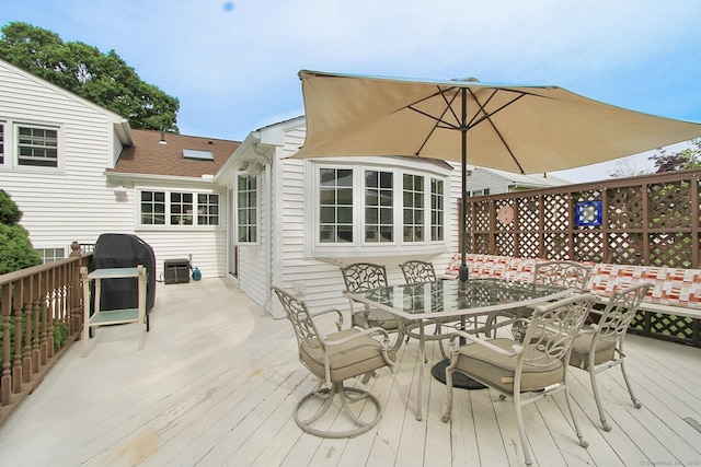 47 Delmont Rd, East Hartford, CT 06108 - wooden deck featuring outdoor dining space and area for grilling