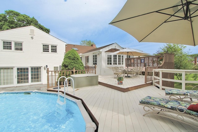 47 Delmont Rd, East Hartford, CT 06108 - swimming pool with a wooden deck and outdoor dining area