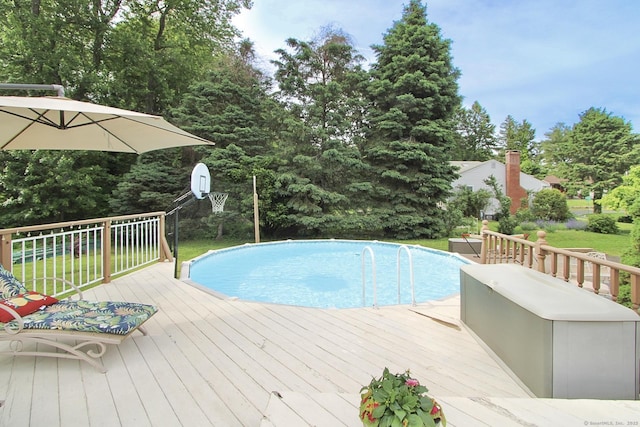 47 Delmont Rd, East Hartford, CT 06108 - swimming pool featuring a deck and a lawn
