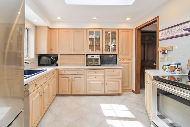 47 Delmont Rd, East Hartford, CT 06108 - kitchen featuring stainless steel appliances, a sink, light countertops, glass insert cabinets, and recessed lighting