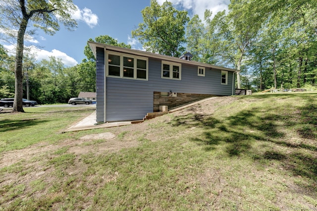 187 W Main St, East Lyme, CT 06357 - rear view of house featuring a yard