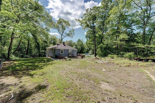 187 W Main St, East Lyme, CT 06357 - view of grassy yard with a deck and a view of trees