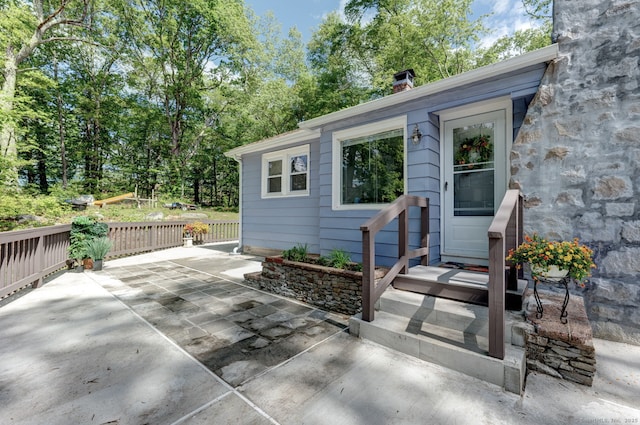 187 W Main St, East Lyme, CT 06357 - property entrance with a chimney