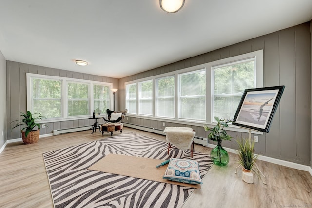 187 W Main St, East Lyme, CT 06357 - sunroom featuring a decorative wall, wood finished floors, and baseboards