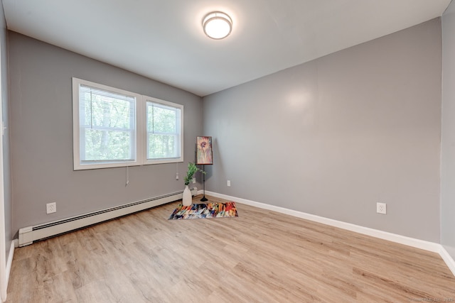 187 W Main St, East Lyme, CT 06357 - unfurnished room with a baseboard heating unit, wood finished floors, and baseboards