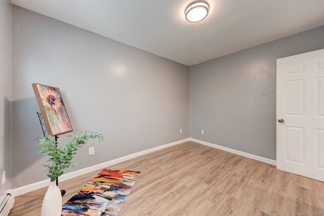 187 W Main St, East Lyme, CT 06357 - spare room with light wood finished floors, a baseboard radiator, and baseboards
