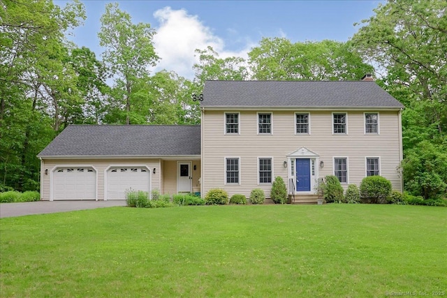109 Edstrom Rd, Marlborough, CT 06447 - colonial house featuring a garage, asphalt driveway, a front lawn, and a chimney
