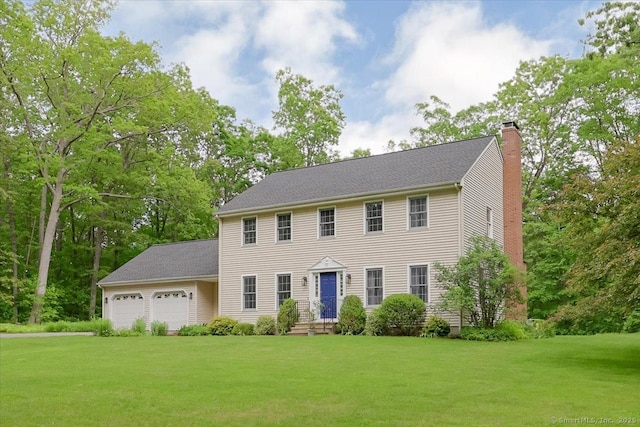 109 Edstrom Rd, Marlborough, CT 06447 - colonial house with a chimney, an attached garage, and a front lawn