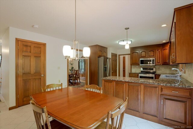 109 Edstrom Rd, Marlborough, CT 06447 - dining area with a chandelier and light tile patterned floors