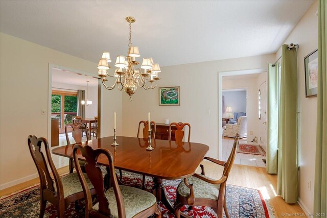 109 Edstrom Rd, Marlborough, CT 06447 - dining space featuring a chandelier and light wood-style floors