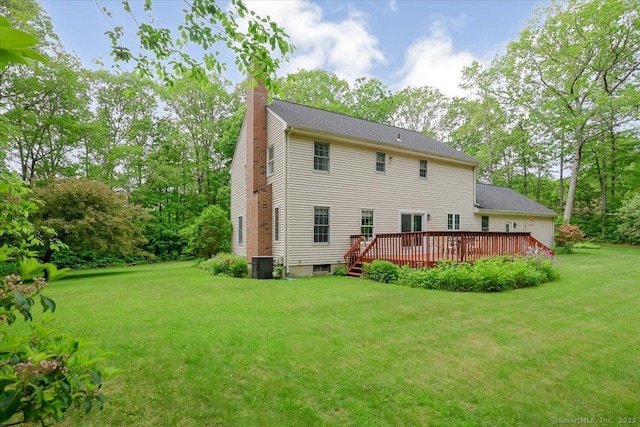 109 Edstrom Rd, Marlborough, CT 06447 - rear view of house with a chimney, central AC unit, a deck, and a yard
