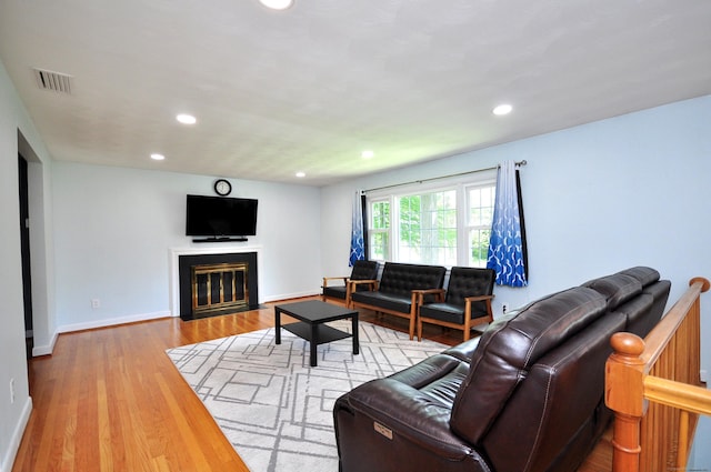 83 Elizabeth St, South Windsor, CT 06074 - living room featuring wood finished floors, recessed lighting, baseboards, and a fireplace with flush hearth